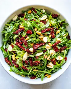 Arugula Salad with Sun Dried Tomatoes and Pine Nuts