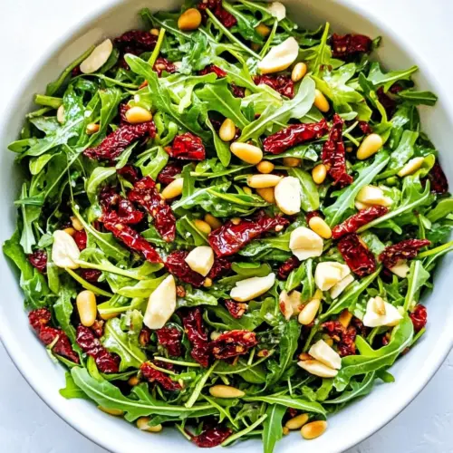 Arugula Salad with Sun Dried Tomatoes and Pine Nuts